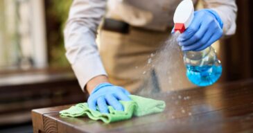 closeup-waitress-disinfecting-tables-outdoor-cafe_637285-7996-1024x682
