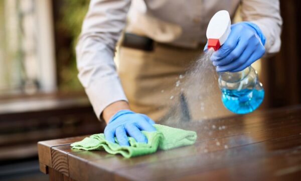 closeup-waitress-disinfecting-tables-outdoor-cafe_637285-7996-1024x682